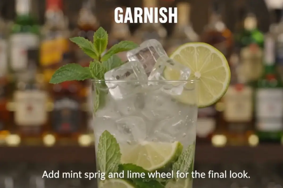 Add ice cubes, garnish with mint and lime, and serve immediately.