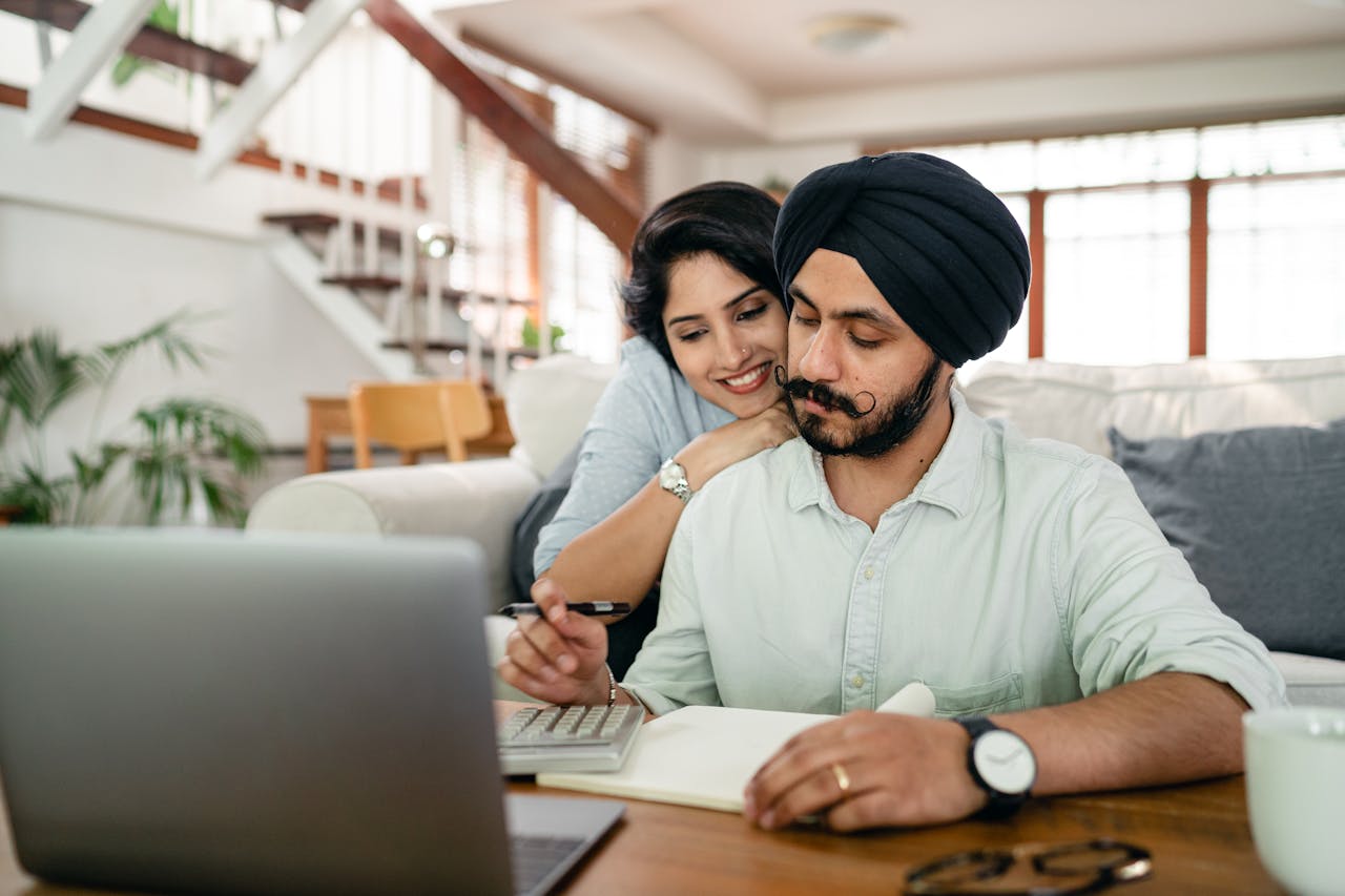 Person working on a laptop in a cozy home office, representing the flexibility and freedom of remote work.