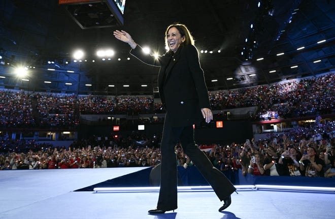 US Vice President and Democratic presidential candidate Kamala Harris arrives to speak at a "When We Vote We Win" campaign rally at the Veterans Memorial Coliseum at Alliant Energy Center in Madison, Wisconsin on October 30, 2024.