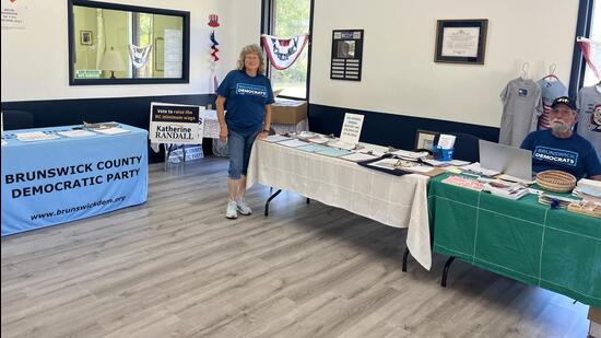 Mark and Amy moved from Ohio and now volunteer at the Democratic Party headquarters in Brunswick County. They flag the threat of misinformation.  (HT)