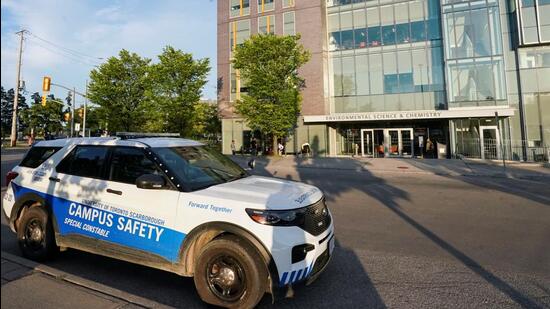 A police vehicle is parked outside of the University of Toronto's Scarborough Campus, on August 6 (REUTERS)