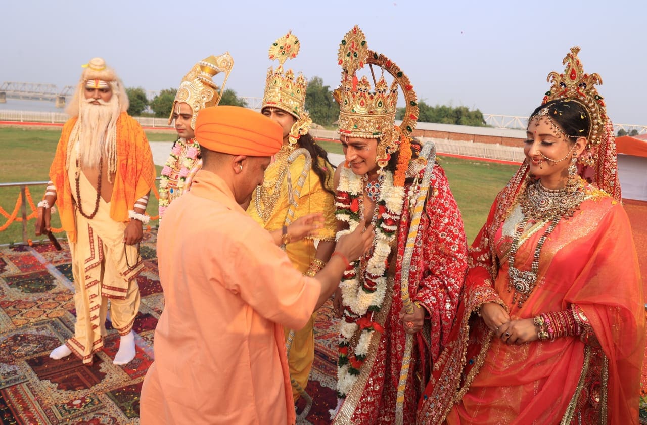 Uttar Pradesh chief minister Yogi Adityanath greets artists dressed as Lord Rama, Lord Lakshmana and Goddess Sita during 'Deepotsav 2024' celebration on the eve of the Diwali, in Ayodhya, Wednesday, Oct. 30, 2024. (Deepak Gupta/Hindustan Times)