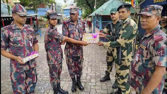 Border Security Force and Border Guard of Bangladesh officials exchange greetings on India’s Independence Day this year in Dakshin Dinajpur district. (PTI File Photo)