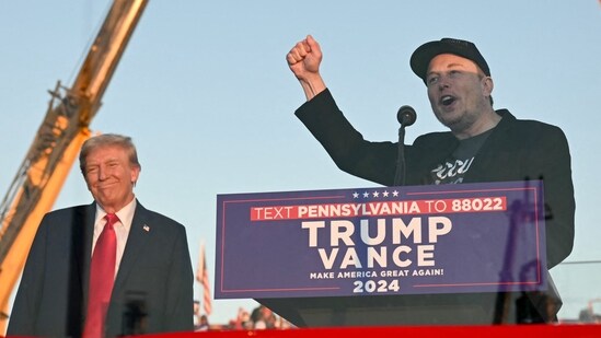 Tesla CEO Elon Musk (R) speaks on stage as he joins former US President and Republican presidential candidate Donald Trump during a campaign rally at site of his first assassination attempt in Butler, Pennsylvania on October 5, 2024. (AFP)