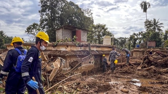 Indian Navy's disaster relief team conducts search and rescue operation at a landslide-hit area in Wayanad. (PTI)