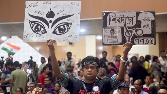 Kolkata: A person holds posters during a mass convention called by the West Bengal Junior Doctors Front, demanding justice for the alleged sexual assault and murder of a postgraduate trainee doctor, at R G Kar Medical College and Hospital, in Kolkata, Saturday, Oct 26, 2024.(PTI)