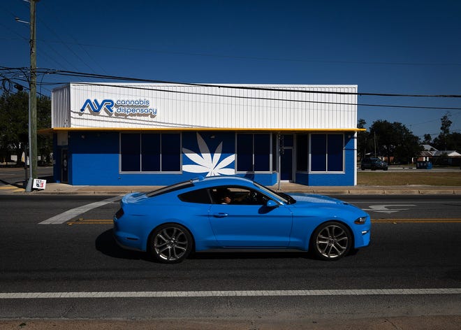 A motorist drives near AYR Cannabis Dispensary in Panama City, Florida on Oct. 24, 2024. Marijuana ballot measure Amendment 3 will be voted upon on Nov. 5.