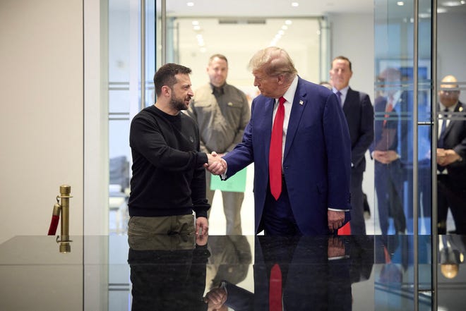 This handout photograph released by the Ukrainian presidential press service shows Ukrainian President Volodymyr Zelensky (L) and Republican presidential nominee former US President Donald Trump, shake hands during a meeting on September 27, 2024 in New York.