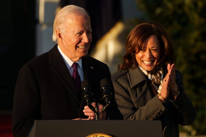 President Joe Biden speaks as Vice President Kamala Harris cheers for him during a ceremony on the South Lawn of the White House to sign the Respect for Marriage Act on Dec. 13, 2022.