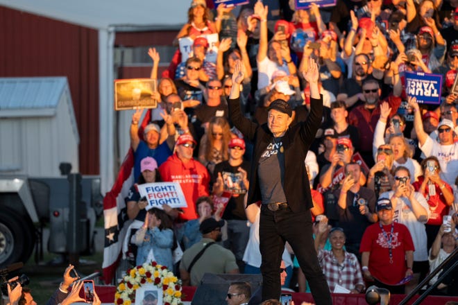 Elon Musk joins Donald Trump on stage Oct. 5 in Butler, Pennsylvania as Trump speaks at a campaign rally.