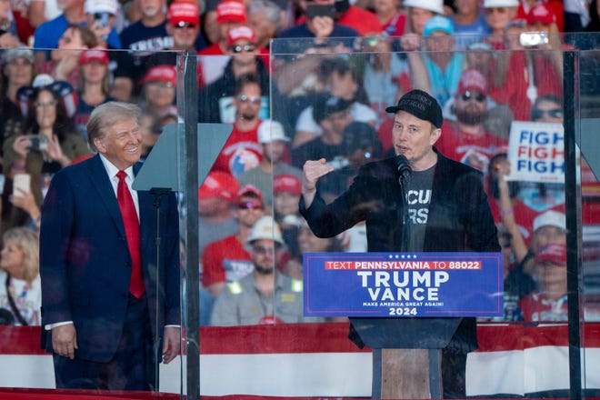 Elon Musk joins Donald Trump on stage Oct. 5 in Butler, Pennsylvania as Trump speaks at a campaign rally.