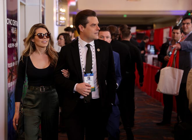 Rep. Matt Gaetz (R-FL) walks with his wife, Ginger Luckey, as they attend the Conservative Political Action Conference (CPAC) at The Rosen Shingle Creek on February 25, 2022 in Orlando, Florida. CPAC, which began in 1974, is an annual political conference attended by conservative activists and elected officials.