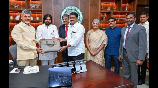 Andhra Pradesh chief minister N Chandrababu Naidu and deputy CM Pawan Kalyan at the legislative assembly in Amaravati on Monday. (ANI)