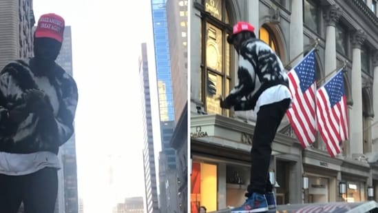 The image shows a man in a MAGA hat perched on a Tesla Cybertruck. (Screengrab)