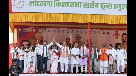 Defence Minister Rajnath Singh with All Jharkhand Student Union (AJSU) Chief Sudesh Mahato during an election campaign ahead of the Jharkhand Assembly elections, in Lohardaga district. (PTI)