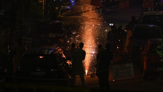 People burst crackers on the occasion of Diwali at Pandav Nagar in New Delhi on October 31.(Ajay Aggarwal/ Hindustan Times)