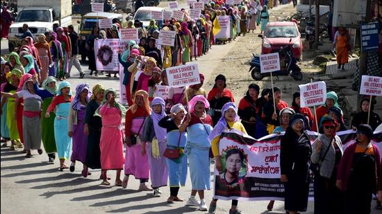 Demonstrators hold placards as they take part in a protest rally against recent killings and reimposition of the Armed Forces Special Powers Act (AFSPA) in six police station areas of Manipur. (REUTERS)