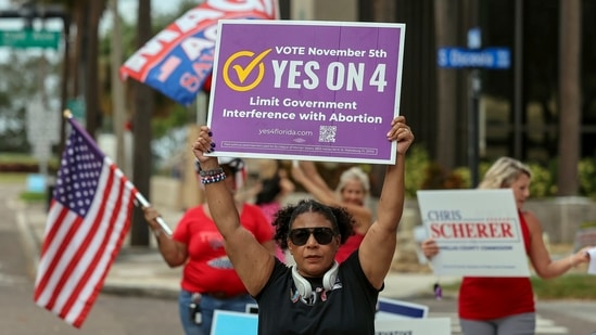 Beth Weinstein rallies in supporter of Yes on Amendment 4 regarding abortion in Florida outside of the polling place at the courthouse(AP)