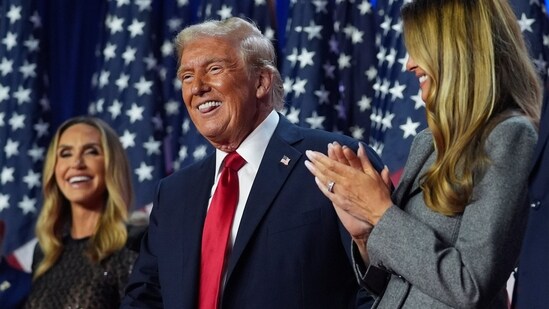 Republican presidential nominee former President Donald Trump stands on stage with former first lady Melania Trump. (AP Photo/Evan Vucci)(AP)