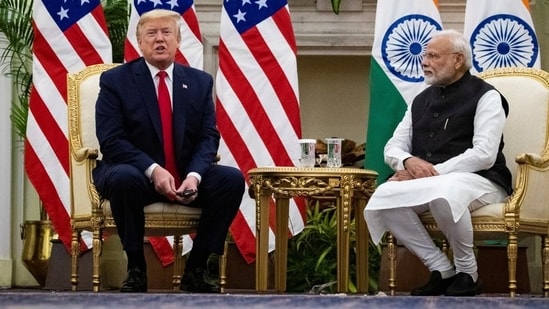 FILE -- US President Donald Trump speaks with Prime Minister Narendra Modi during their meeting at Hyderabad House in New Delhi, on February 25, 2020. (REUTERS)