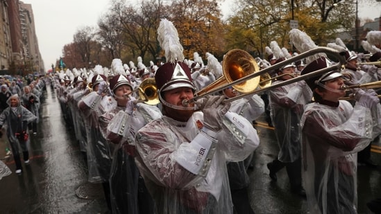 The University of Massachusetts Minutemen marching band plays as it makes its way down Central Park West while participating in the Macy's Thanksgiving Day Parade. (AP)