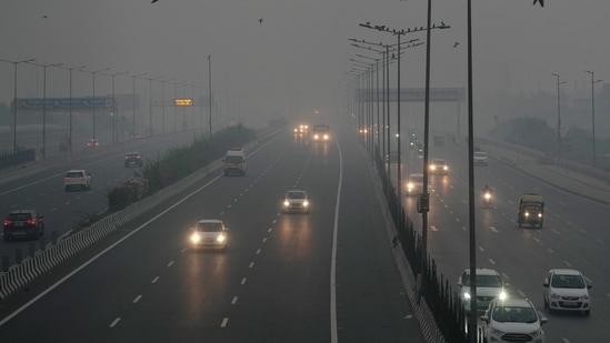 Vehicles move on a road amid low visibility due to smog, a day after Diwali festival celebrations, in New Delhi, early Friday morning, Nov. 1, 2024.(PTI Photo/Kamal Singh)