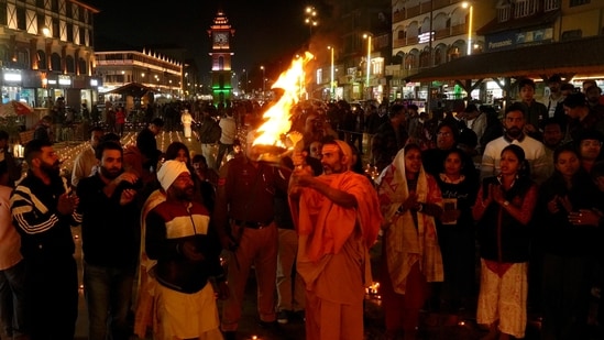 A priest performs 'puja' during the Diwali festival celebrations at Lal Chowk, in Srinagar, Thursday night.(PTI)