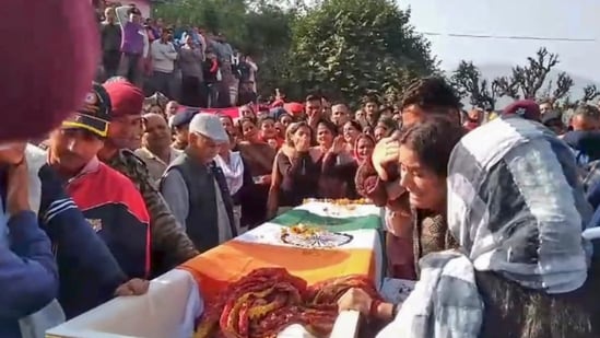 Wife of Naib Subedar Rakesh Kumar mourns after his mortal remains were brought to his residence in Mandi district. (PTI)