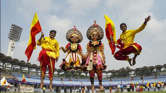 Students in 'yakshagana' attire perform during the celebrations of Karnataka state formation day 'Kannada Rajyotsava', at Sree Kanteerava Stadium in Bengaluru. (PTI)