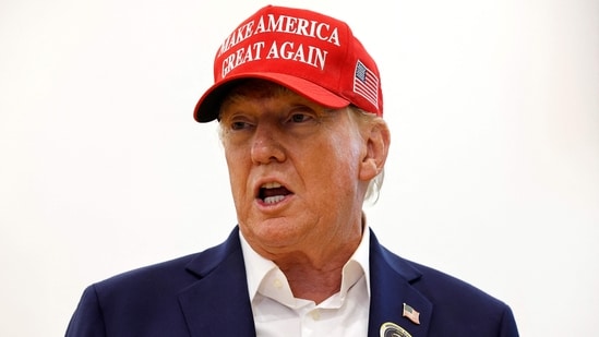 Donald Trump talks to reporters after casting their votes at the polling place in the Morton and Barbara Mandel Recreation Center on Election Day, on November 05, 2024 in Palm Beach, Florida. (Getty Images via AFP)