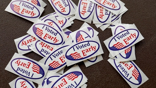 "I voted" stickers are seen during early voting for the US general election at a polling station at Ottawa Hills High School in Grand Rapids, Michigan, on November 3 2024. (Photo by KAMIL KRZACZYNSKI / AFP)(AFP)