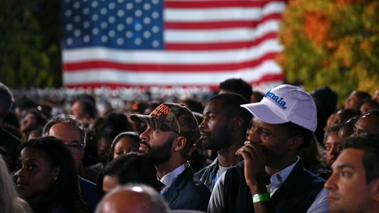 Supporters watch election results as they attend an election night event for US Vice President and Democratic presidential candidate Kamala Harris at Howard University in Washington, DC, on November 5, 2024.(AFP)