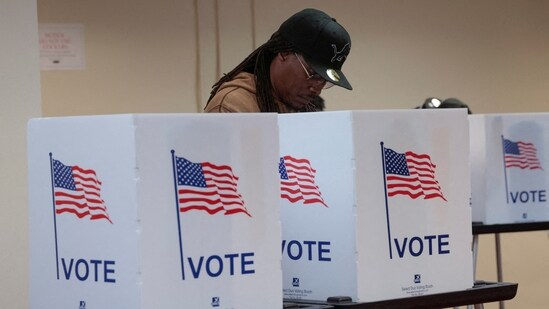 A person votes in the U.S. presidential election at a polling station in Detroit, Michigan(REUTERS)