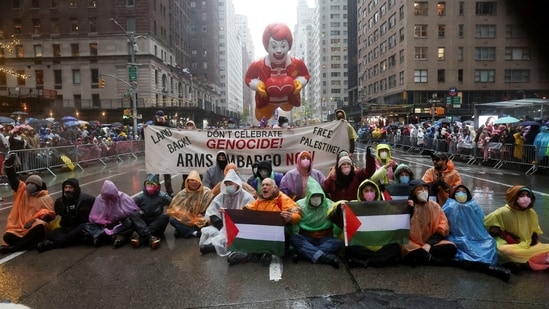 People protest during the 98th Macy's Thanksgiving Day Parade in New York City.(REUTERS)