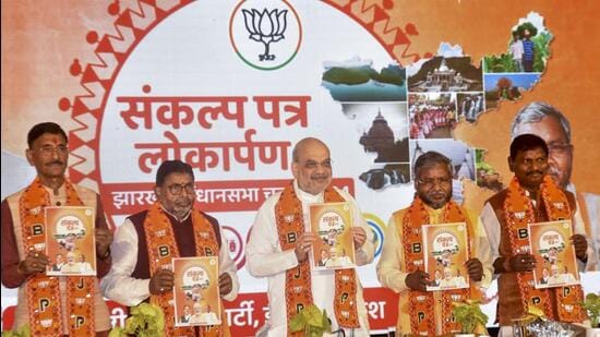 Union home minister Amit Shah releases BJP’s Sankalp Patra (election manifesto) for the upcoming assembly elections, in Ranchi. (PTI)