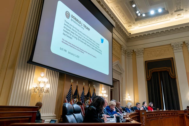 A tweet from former President Donald Trump sent on Jan. 6 is displayed during a House select committee hearing investigating the Jan. 6 attack on the U.S. Capitol in the Cannon House Office Building on October 13, 2022 in Washington, DC.