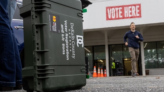 Precinct supervisors collect election materials from the DeKalb County Voter Registration and Elections office in Decatur, Georgia.(AFP)