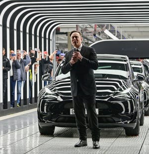 German Chancellor Olaf Scholz, Brandenburg Premier Dietmar Woidke and Elon Musk attend the opening ceremony of the new Tesla Gigafactory for electric cars in Gruenheide, Germany, March 22, 2022.