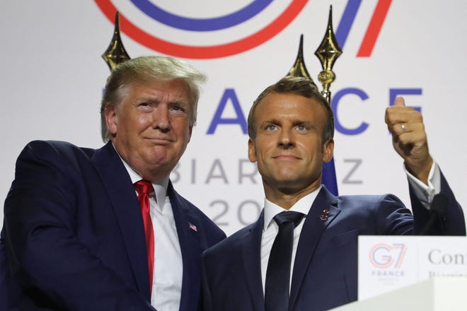 France's President Emmanuel Macron (R) and US President Donald Trump shake hands during a joint-press conference in Biarritz, south-west France on August 26, 2019, on the third day of the annual G7 Summit attended by the leaders of the world's seven richest democracies, Britain, Canada, France, Germany, Italy, Japan and the United States. (Photo by ludovic MARIN / AFP) (Photo by LUDOVIC MARIN/AFP via Getty Images)