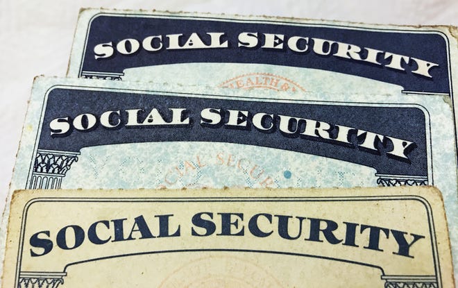 U.S. Social Security card designs over the past several decades are shown in this photo illustration.