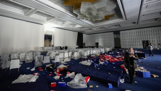 People also ransacked a conference room, and stole other ornaments from the palace.  (AP)