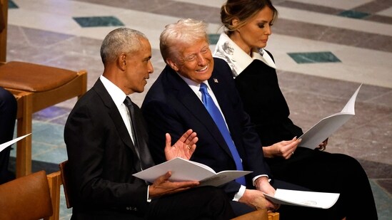 U.S. President-elect Donald Trump speaks with former U.S. President Barack Obama as Melania Trump looks on during the state funeral for former U.S. President Jimmy Carter at Washington National Cathedral on January 09, 2025 in Washington, DC. (Photo by CHIP SOMODEVILLA / GETTY IMAGES NORTH AMERICA / Getty Images via AFP)(Getty Images via AFP)